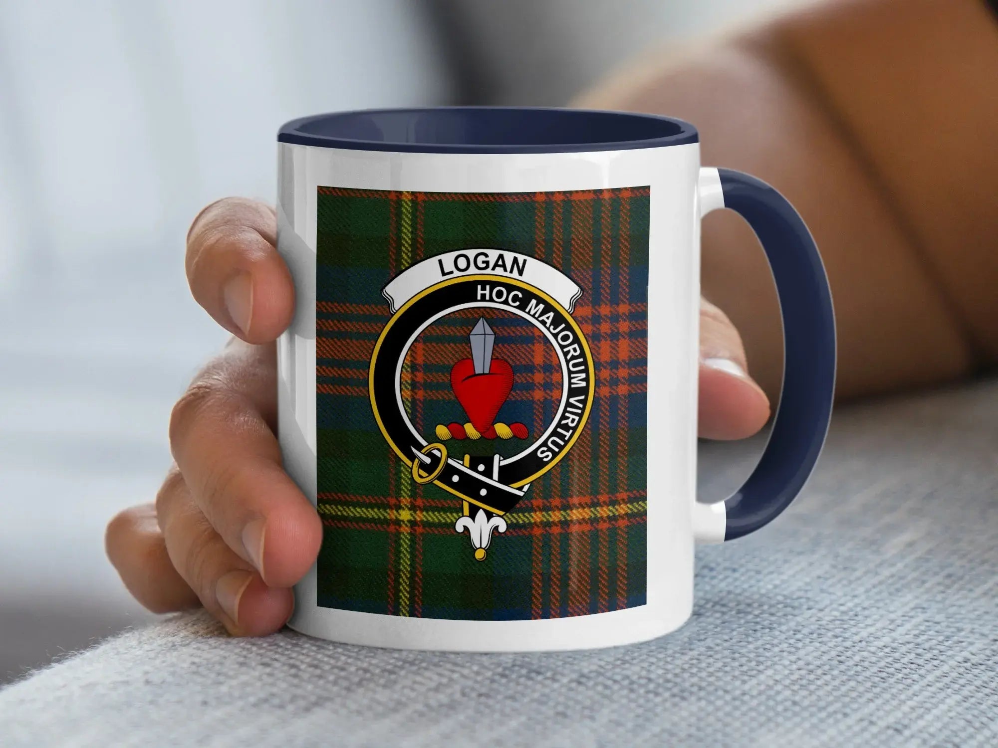 Logan clan crest badge tartan accent mug — glossy ceramic, Hoc Majorum Virtus motto, black handle