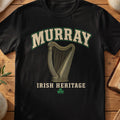 Murray Irish harp T-shirt in Black, with cream surname lettering, a gold-toned harp, green shamrock and “Irish Heritage” text.