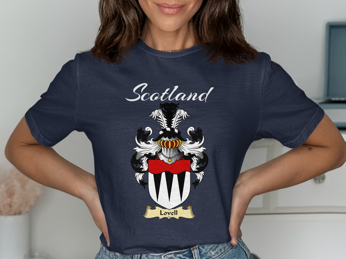 Model wearing a navy Lovell T-shirt featuring a black-and-white pointed pattern beneath a red band