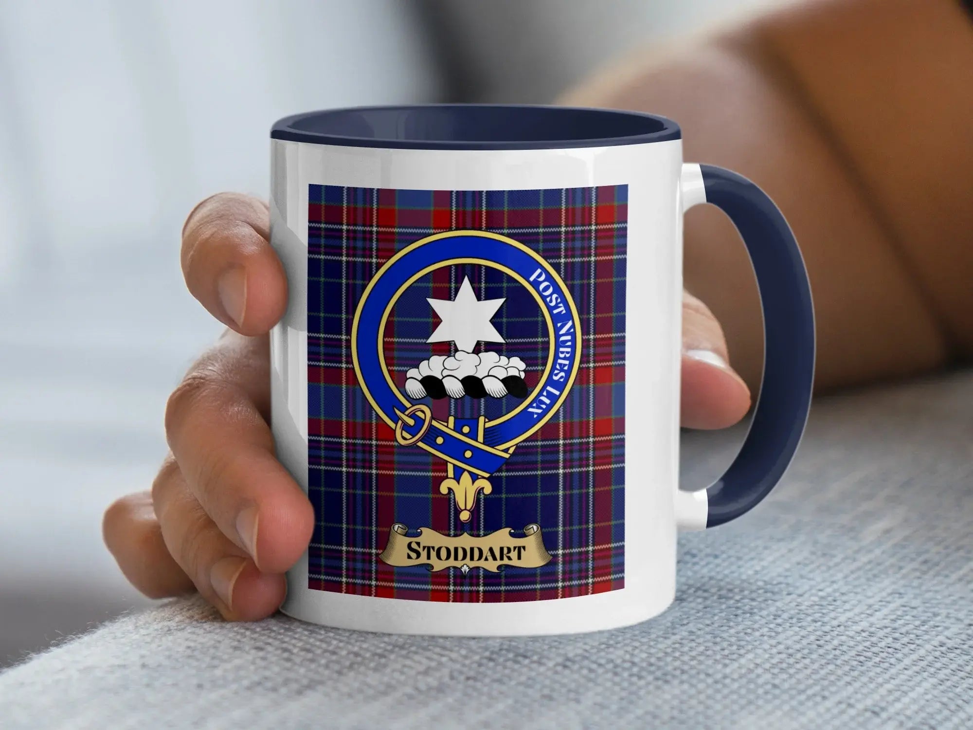 Stoddart family crest coffee mug with a tartan-background design