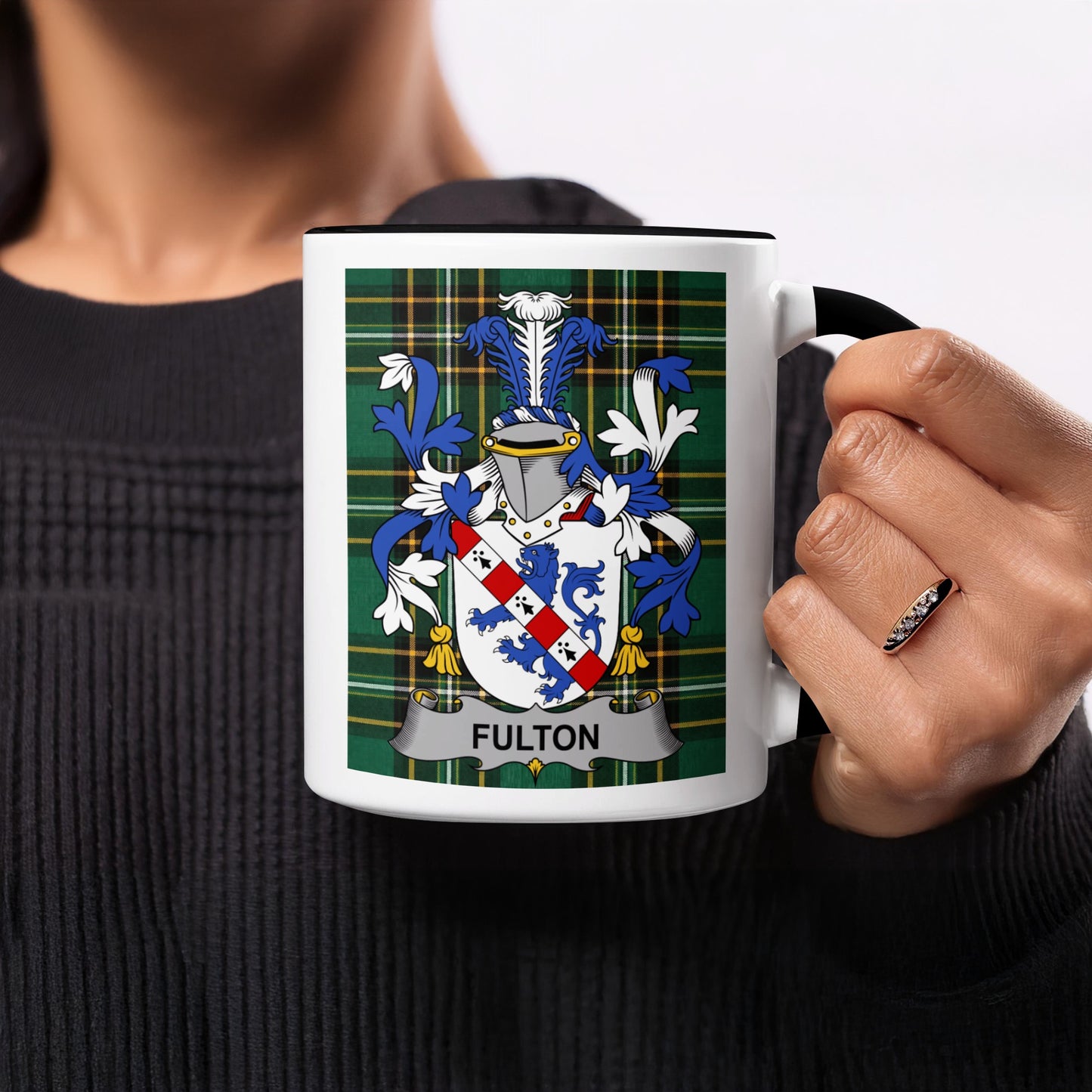 Mug with the Fulton family crest on a tartan background.