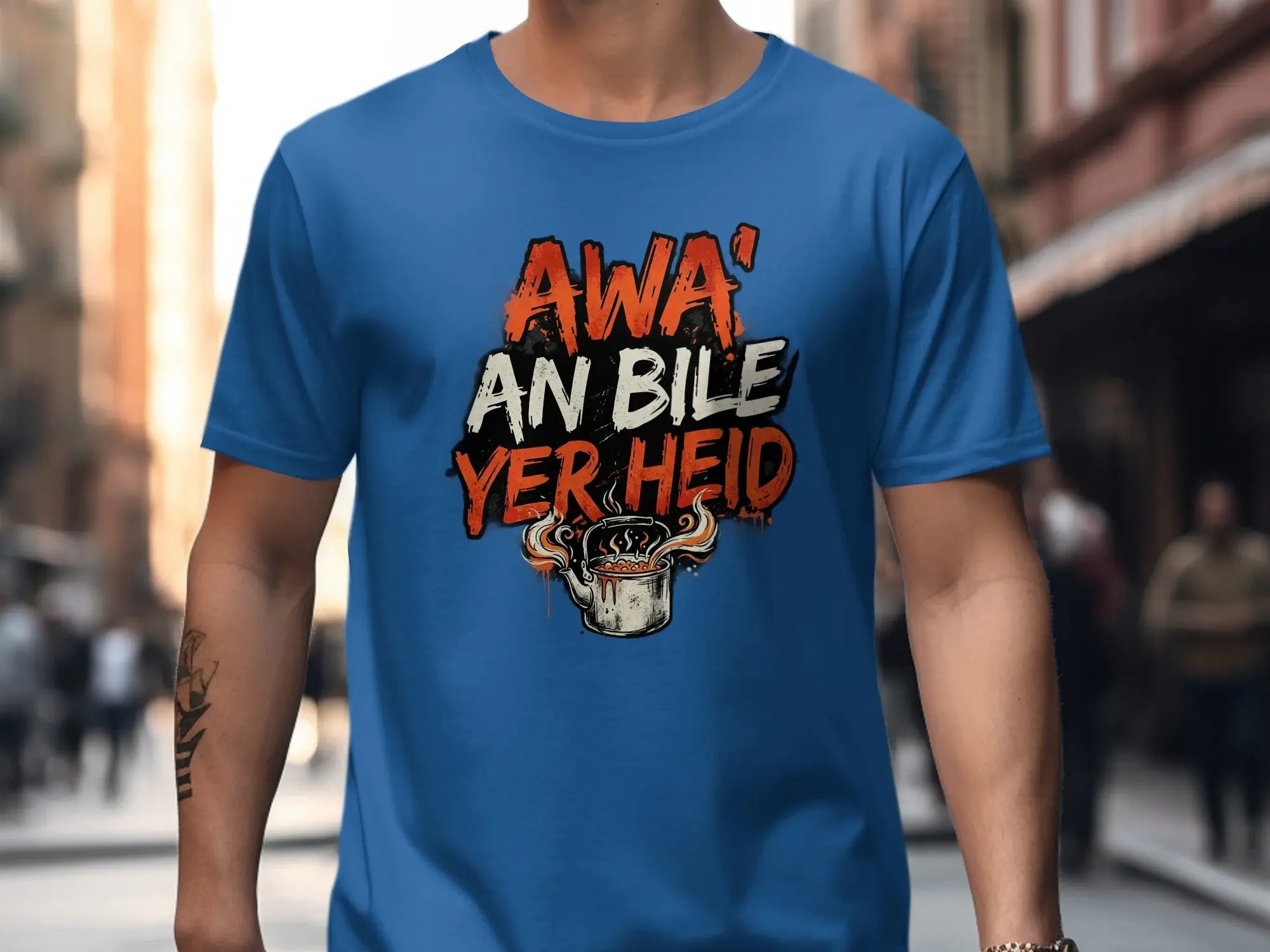 Blue t-shirt with "Awa' an bile yer heid" text and steaming pot graphic.