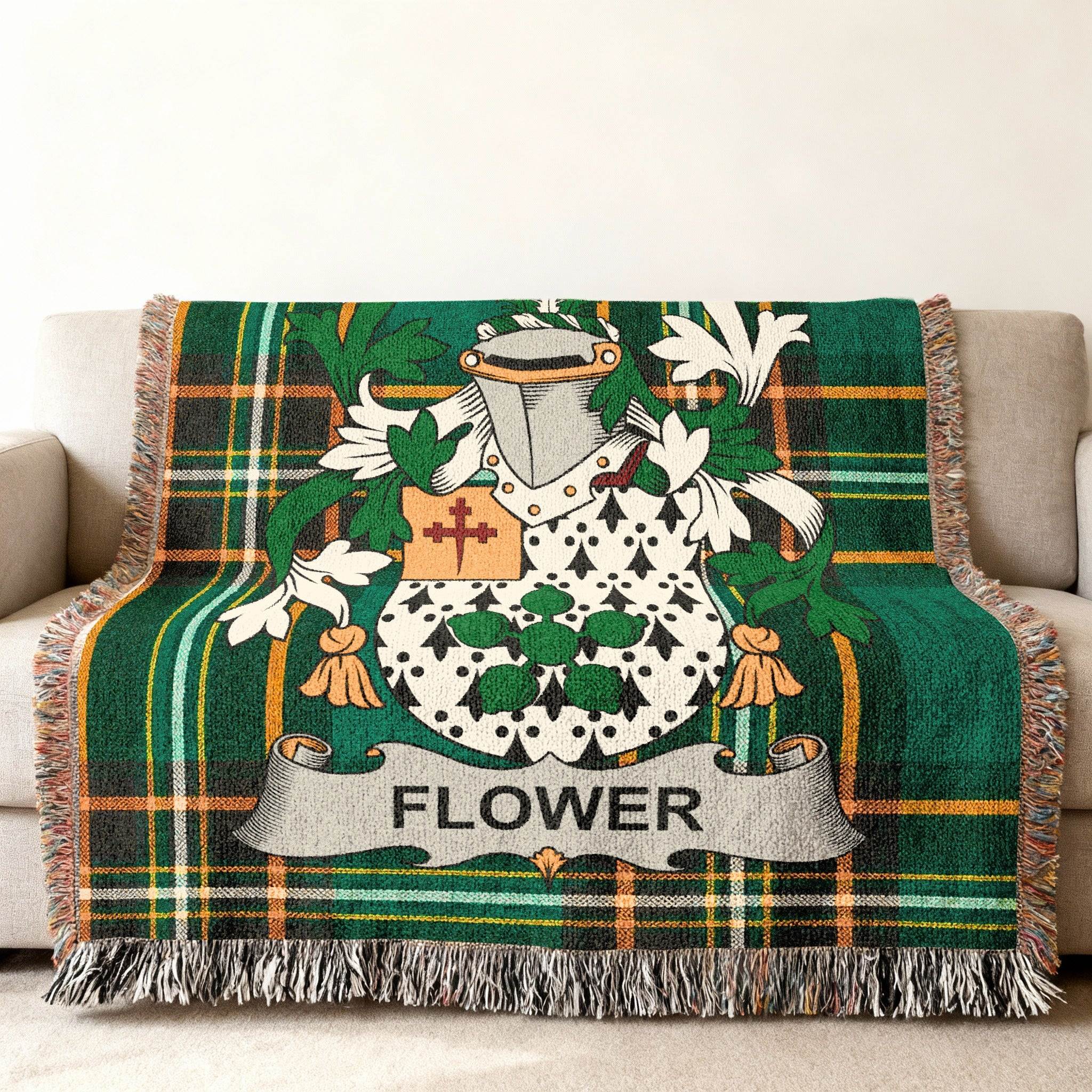 Green plaid blanket with Flower family crest.
