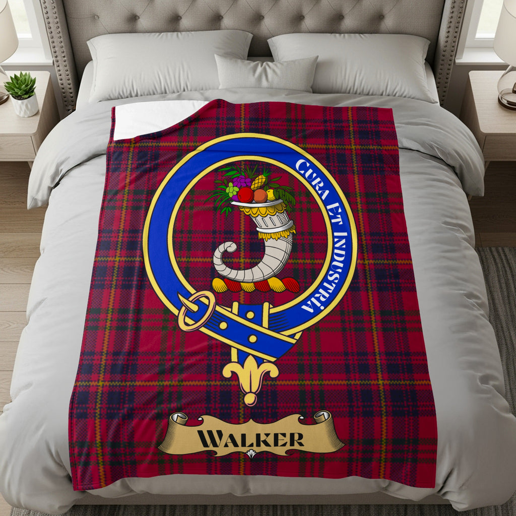 Walker clan crest with Cura et Industria motto on red tartan throw
