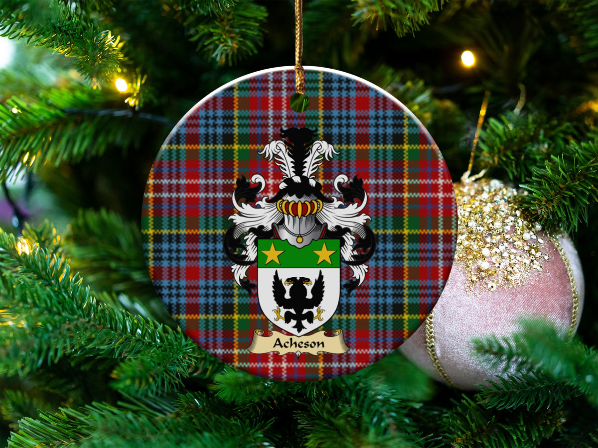 Acheson Scottish clan ceramic ornament with family crest on a Caledonia tartan background, hanging on a Christmas tree