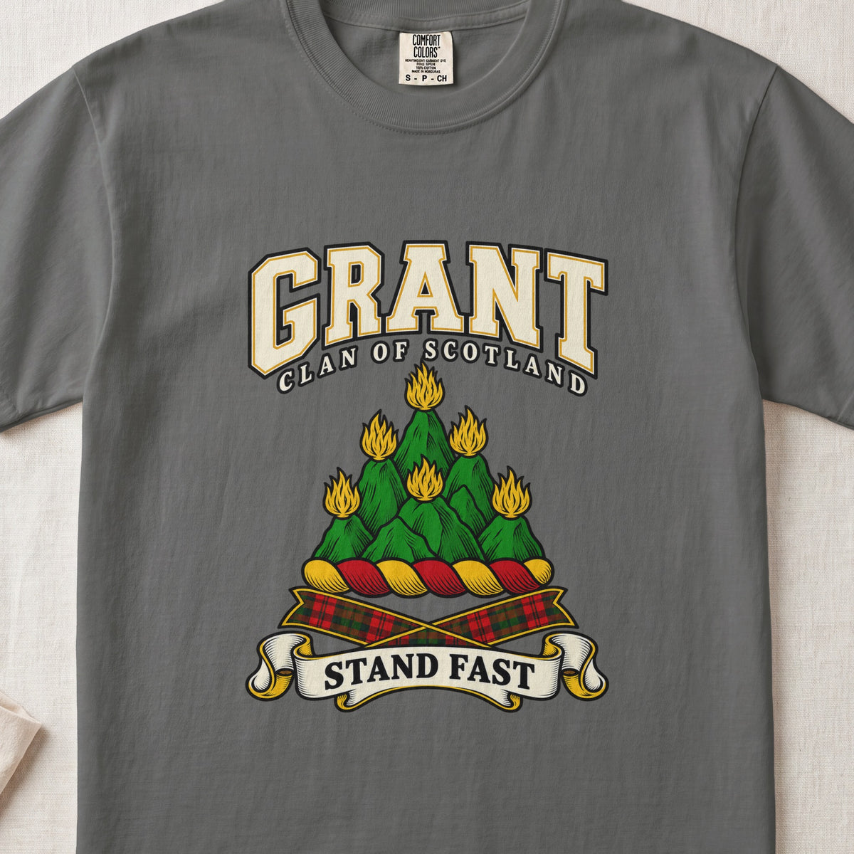 Grant graphic T-shirt in Pepper gray, front flat lay showing varsity lettering and green mountain-like mound with yellow flames.