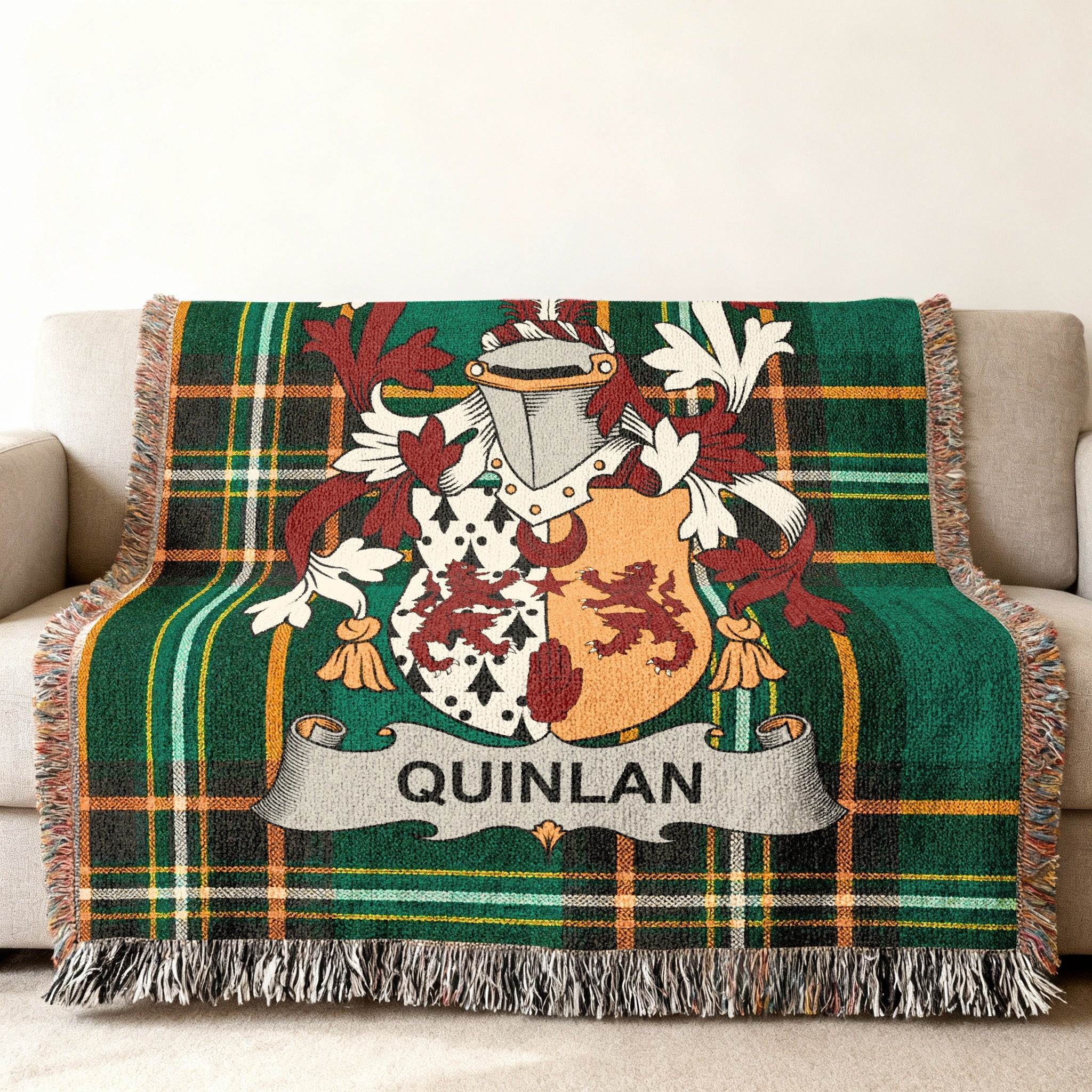 Green plaid throw blanket with the Quinlan family crest.