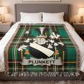 Plunkett family crest on a green and black plaid woven blanket.