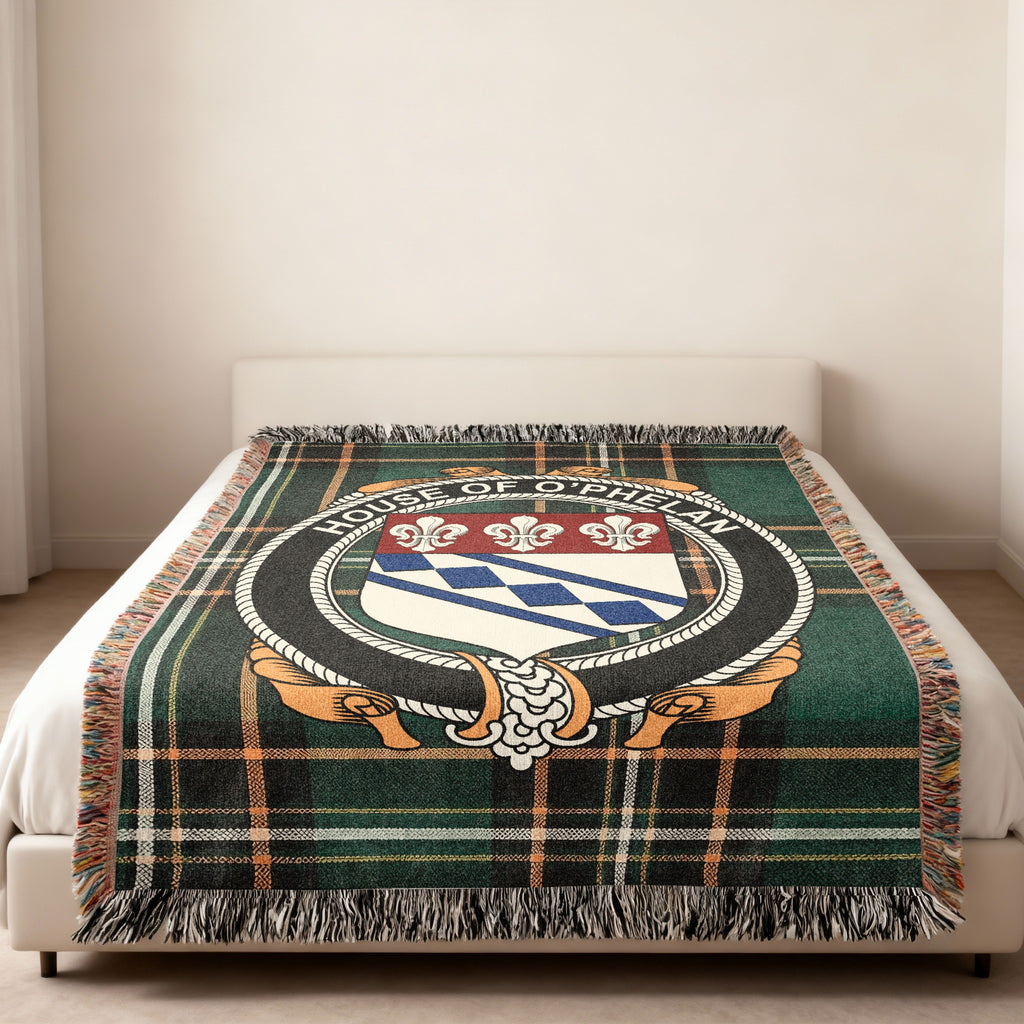 O'Phelan family crest emblem woven blanket displayed on a bed