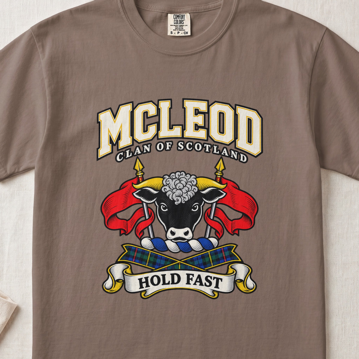 McLeod graphic T-shirt in Espresso brown, front flat lay showing varsity lettering and black bull head with white muzzle and curly white forelock.