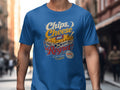 Blue t-shirt with "Chips, Cheese and Chippy Regret" graphic over fries.