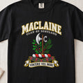 MacLaine Scottish clan T-shirt in Black, front view with a silver axe framed by green foliage and motto banner.