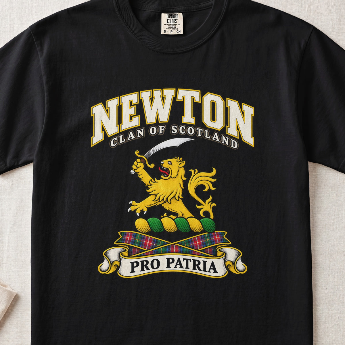 Newton Scottish clan T-shirt in Black, front view with a gold lion holding a curved sword and motto banner.