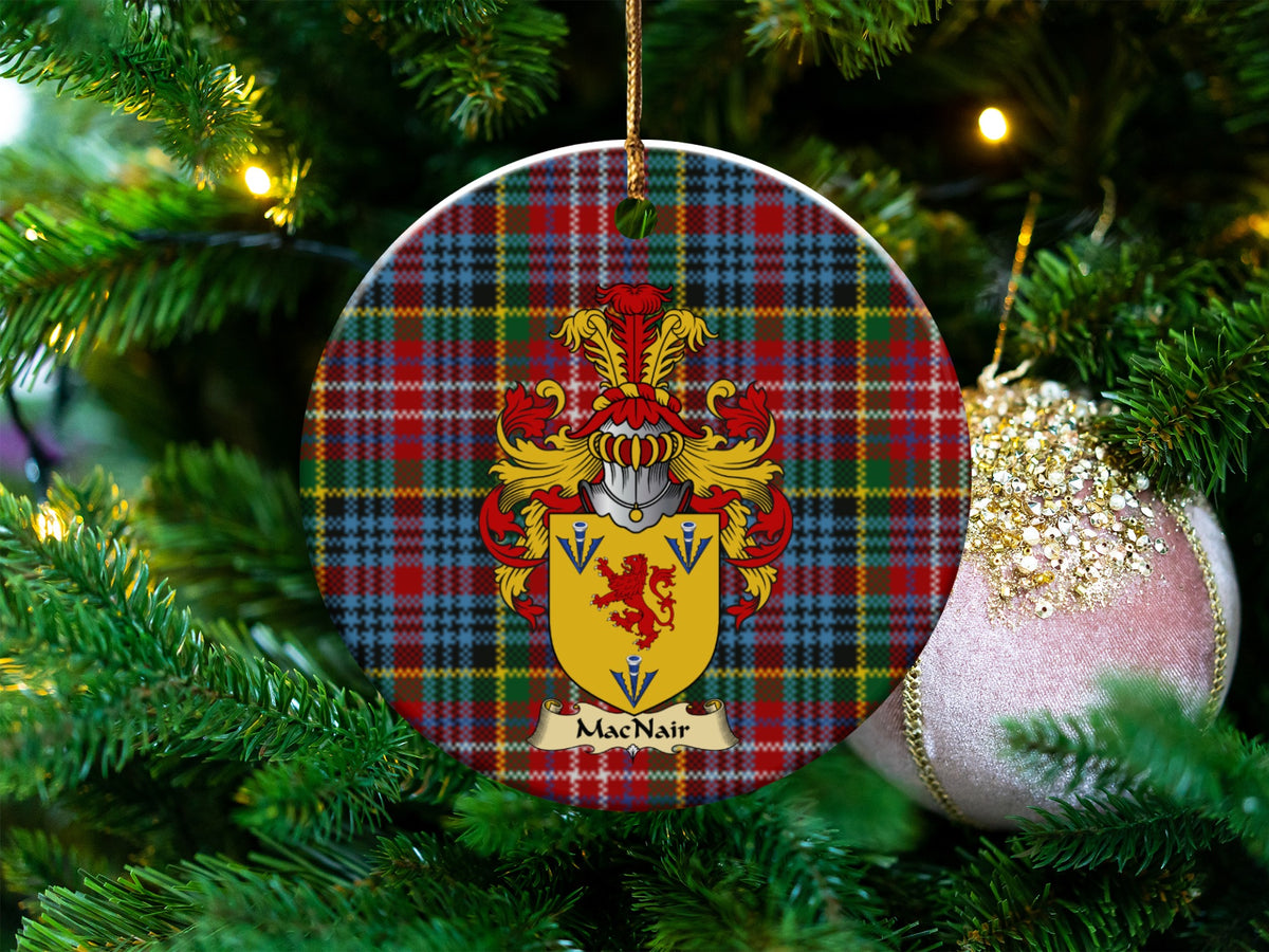 MacNair Scottish clan ceramic ornament with family crest on a Caledonia tartan background, hanging on a Christmas tree
