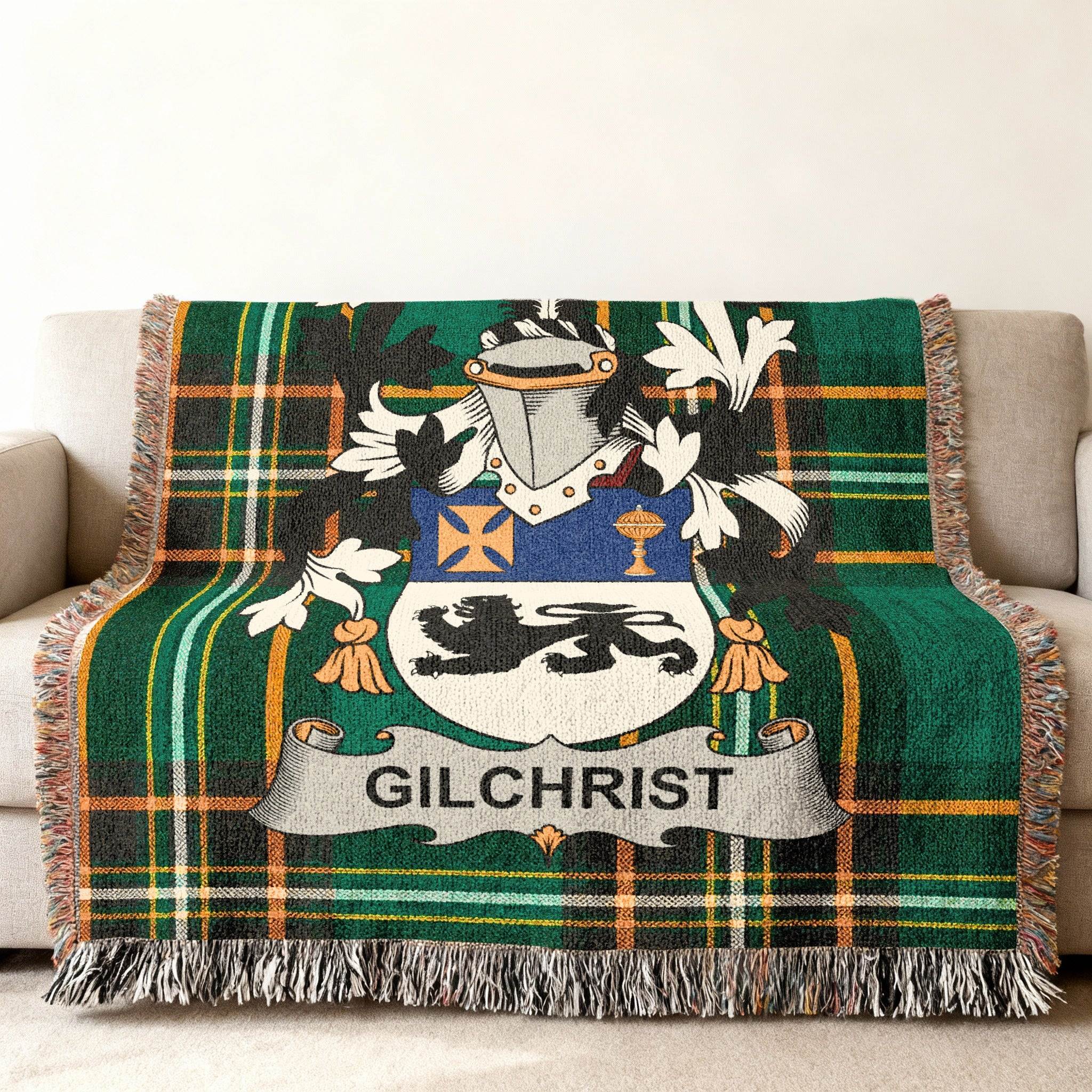 Green plaid throw blanket with the Gilchrist family crest centered.