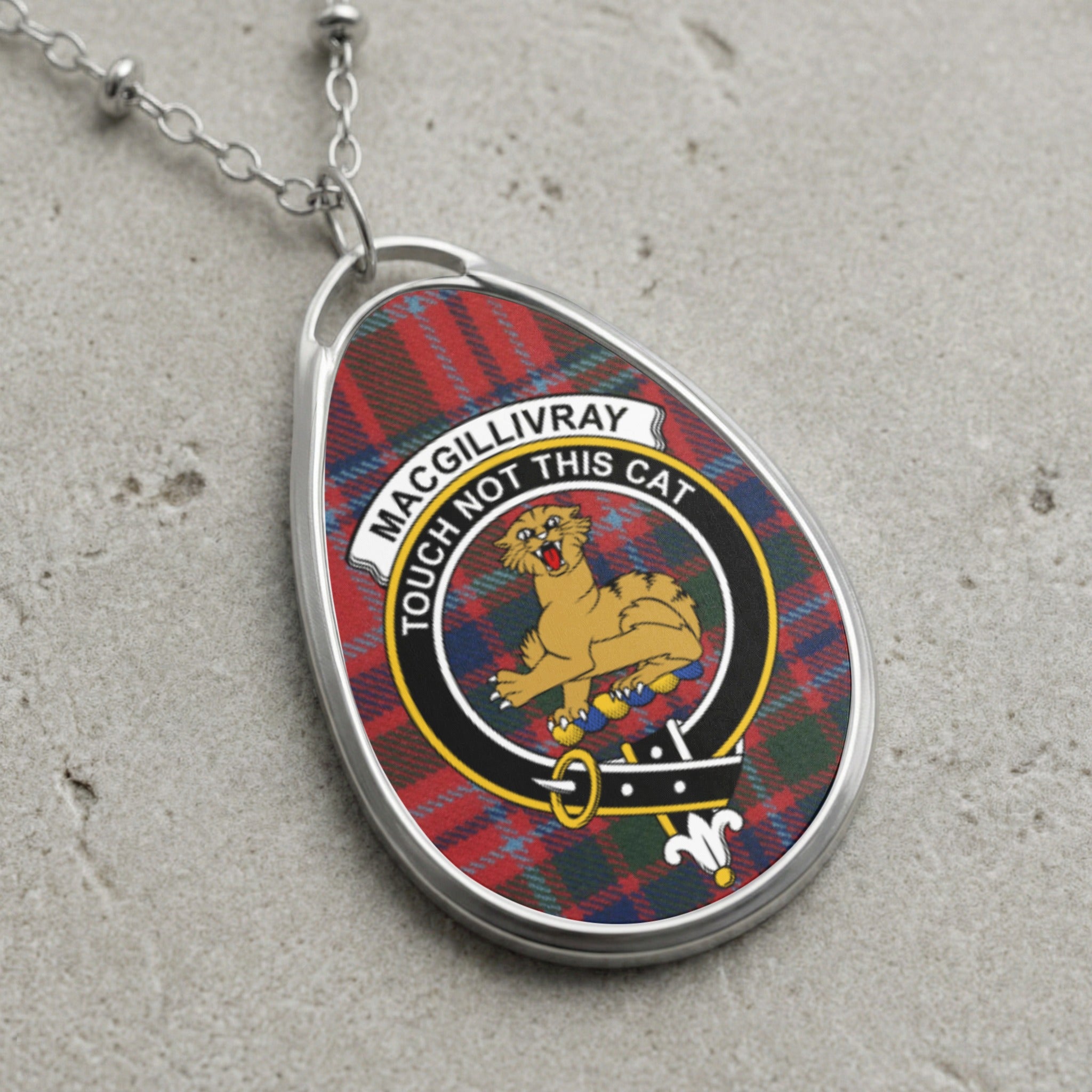 MacGilliivray tartan pendant with a cat and the words "Touch Not This Cat."