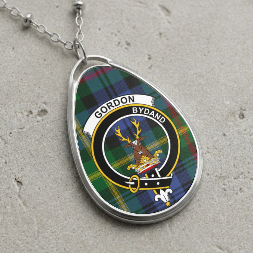 Gordon clan Scottish tartan necklace with clan crest and Bydand motto on tartan background