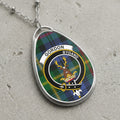 Gordon clan Scottish tartan necklace with clan crest and Bydand motto on tartan background