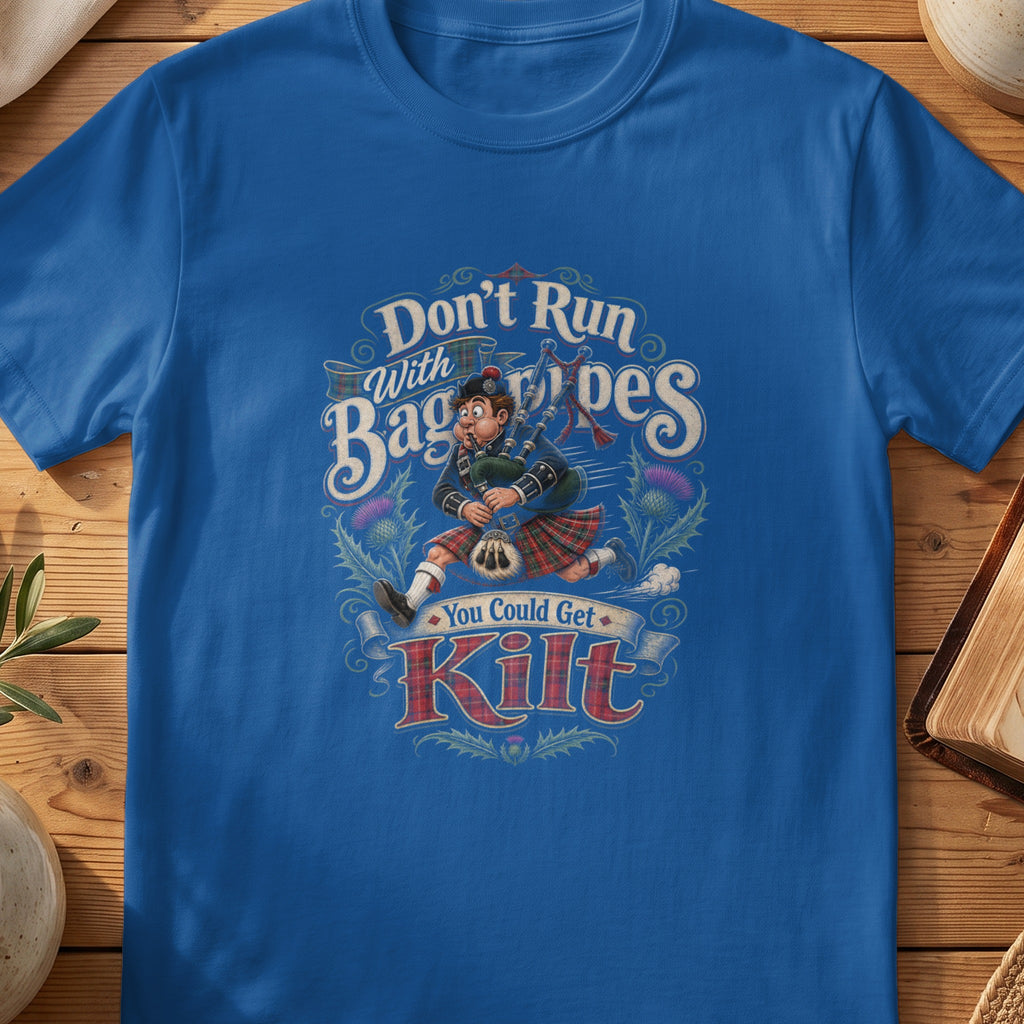 Blue t-shirt with cartoon man playing bagpipes in kilt saying "Don't Run With Bagpipes You Could Get Kilt".