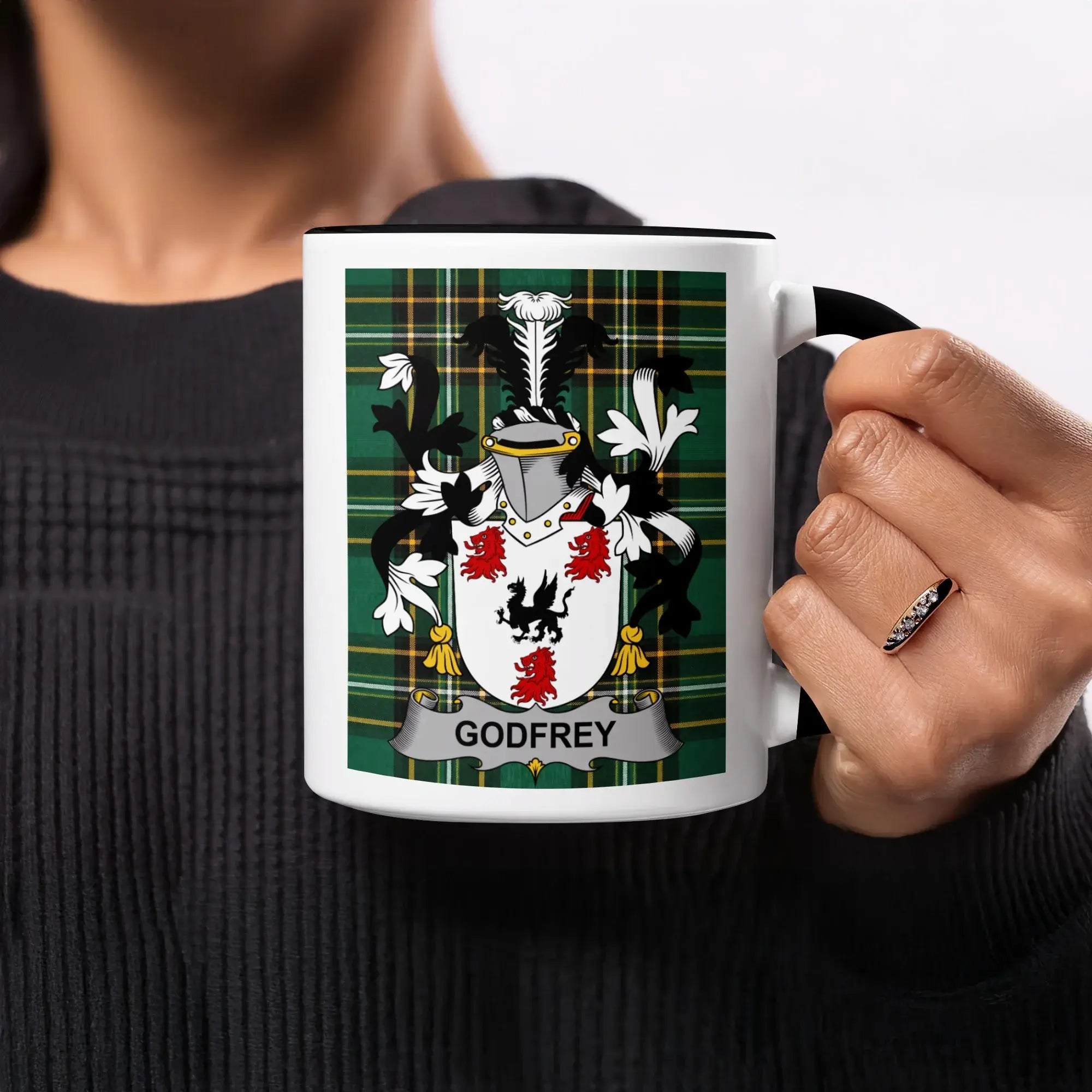 Mug with Godfrey family crest on plaid background.