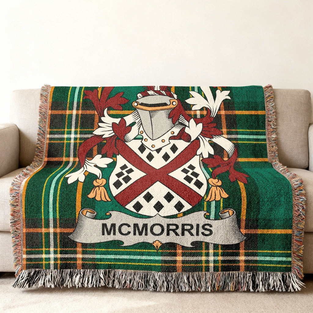 McMorris family crest on a green tartan plaid woven throw blanket.