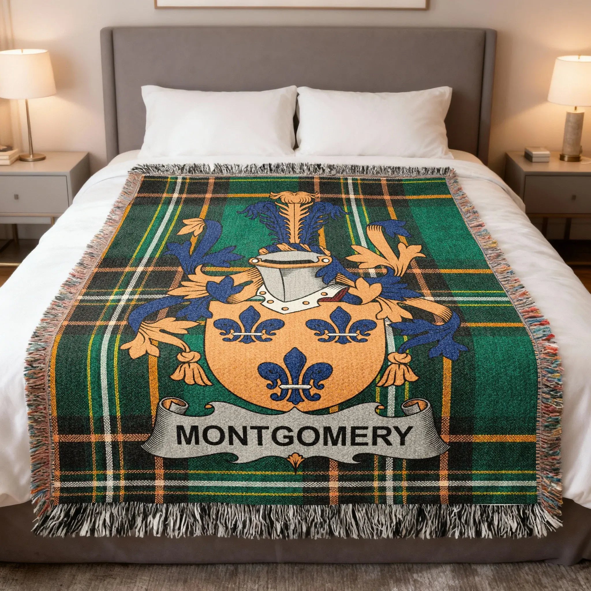 Montgomery family crest on green plaid woven throw blanket on a bed.