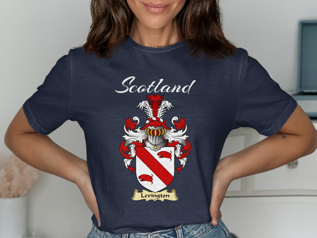 Model wearing a navy Levingston T-shirt featuring a red diagonal band between red animal heads