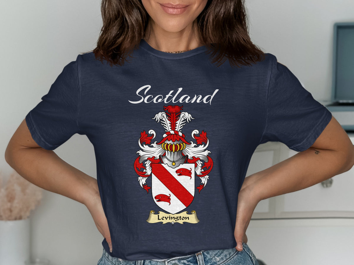 Model wearing a navy Levingston T-shirt featuring a red diagonal band between red animal heads
