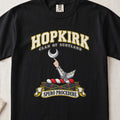 Hopkirk Scottish clan T-shirt in Black, front view with an armoured arm holding a silver crescent and motto banner.