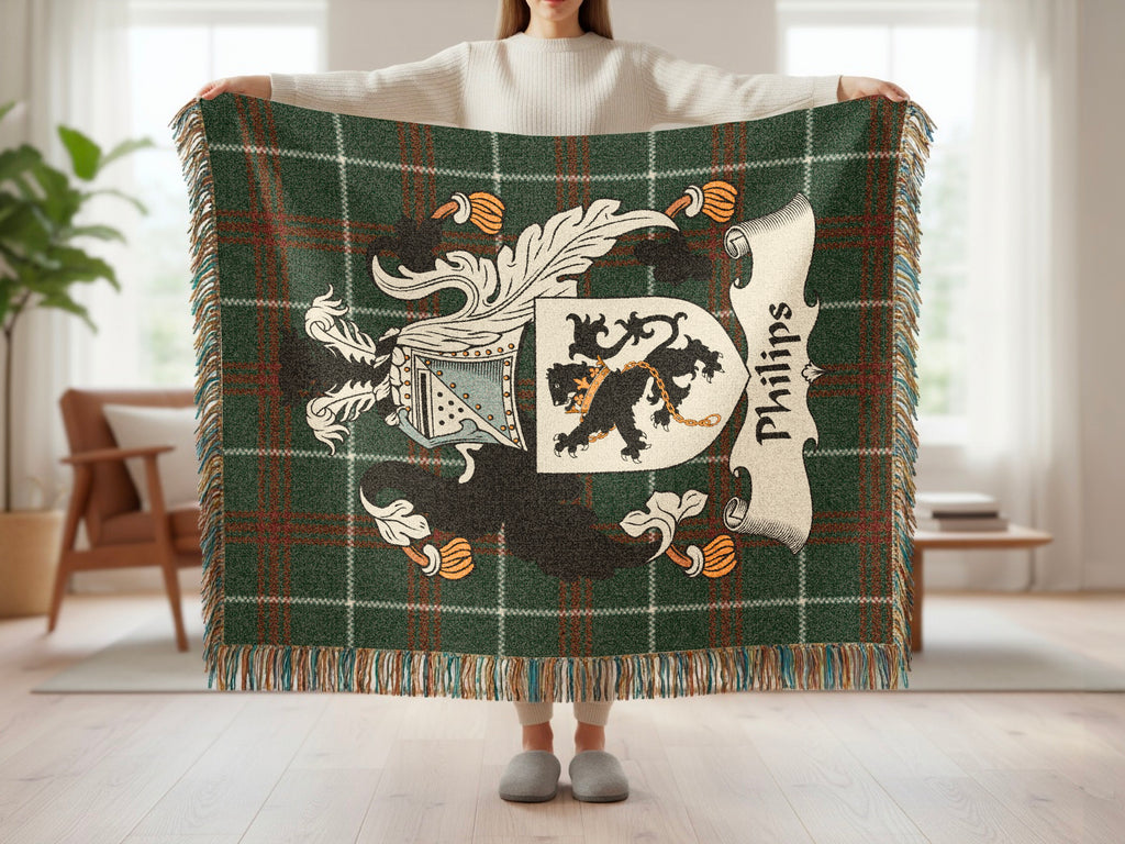 Green tartan blanket with Phillips family crest and name displayed.