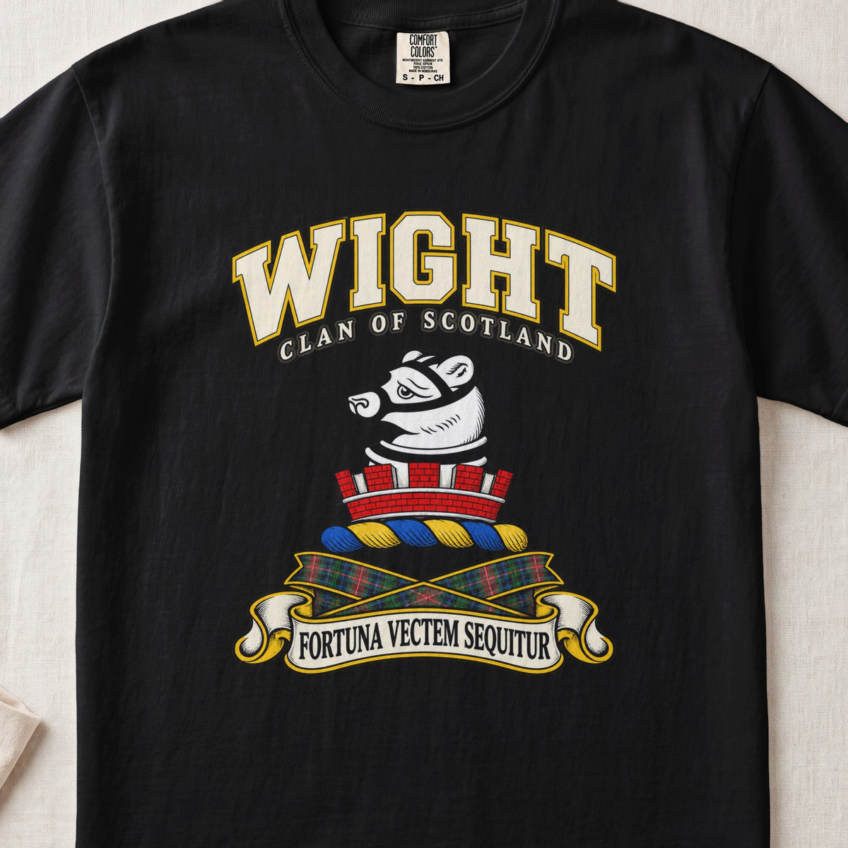 Wight Scottish clan T-shirt in Black, front view with a white muzzled animal head above a red mural crown and motto design.