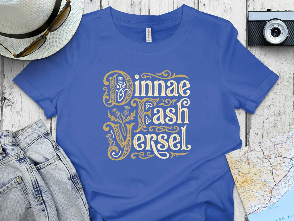 Blue t-shirt with gold Celtic knot lettering "Jinnae Fash Versel".