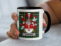 White mug with black rim, featuring the Thacker family crest on a tartan background.