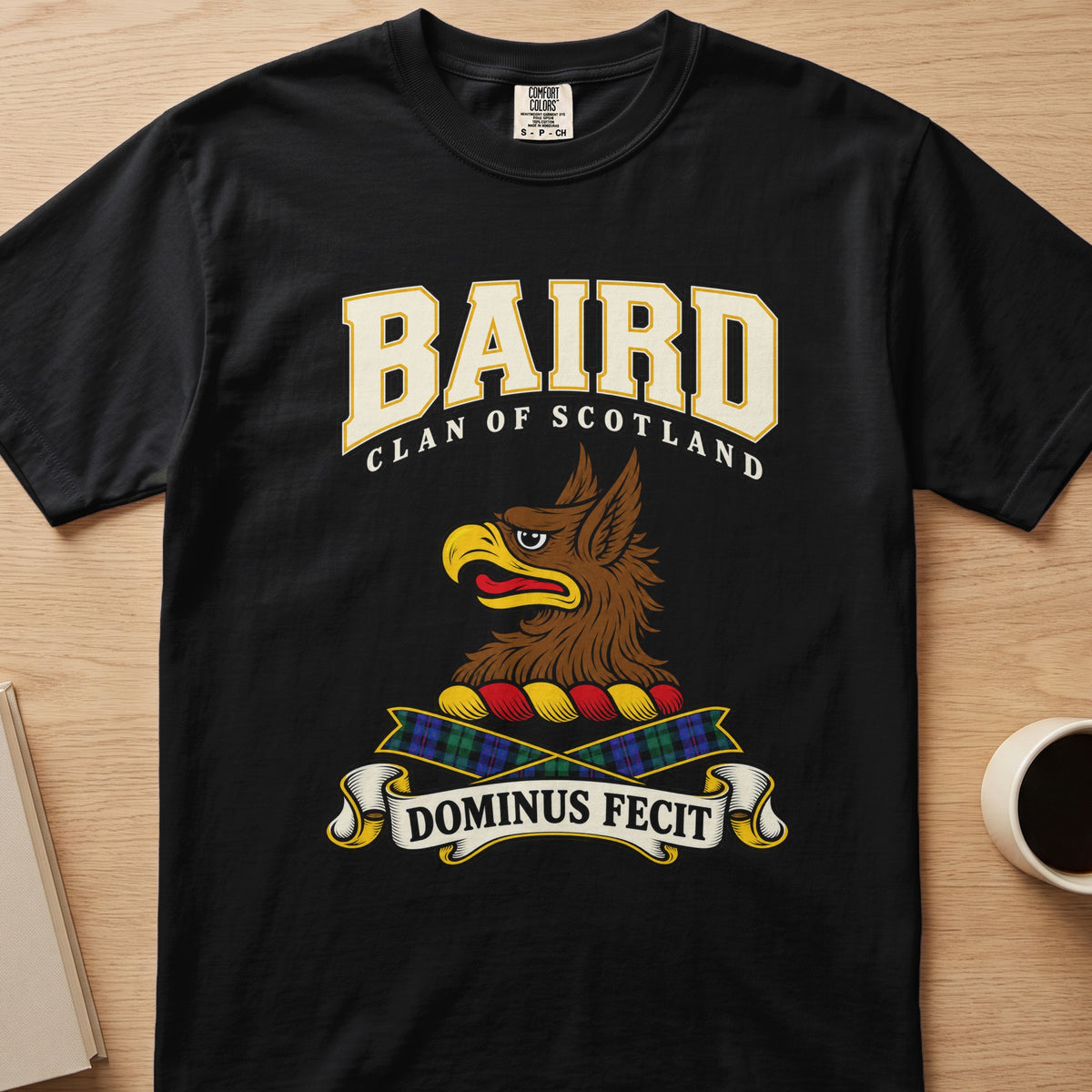Baird clan crest with brown griffin head on a black Comfort Colors T-shirt, front view