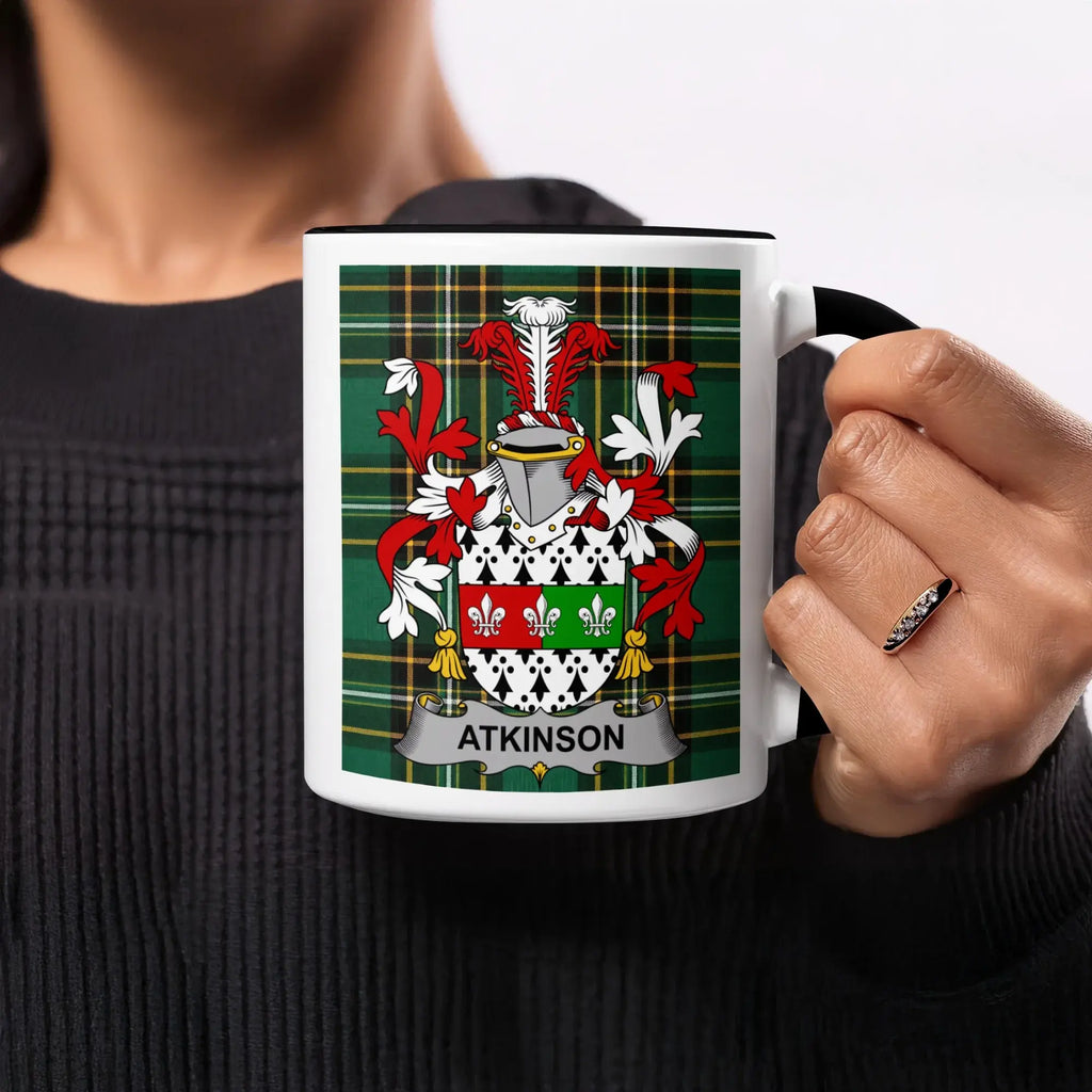Atkinson family crest on a white mug with black rim.