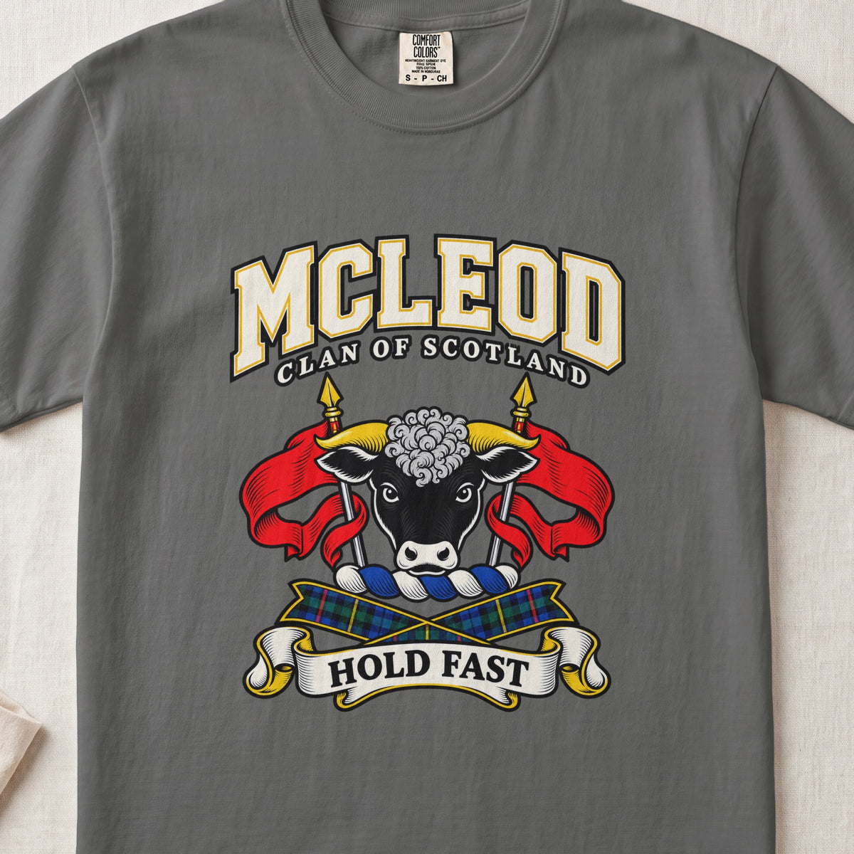 McLeod graphic T-shirt in Pepper gray, front flat lay showing varsity lettering and black bull head with white muzzle and curly white forelock.