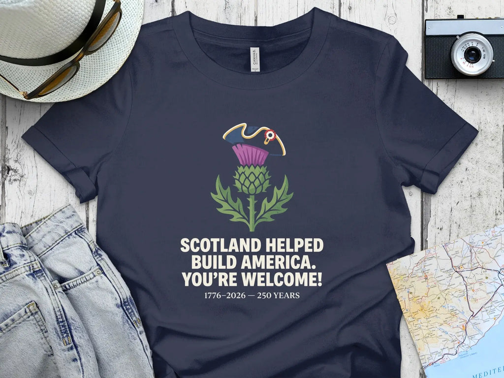 Navy t-shirt with Scotland helped build America text and thistle.