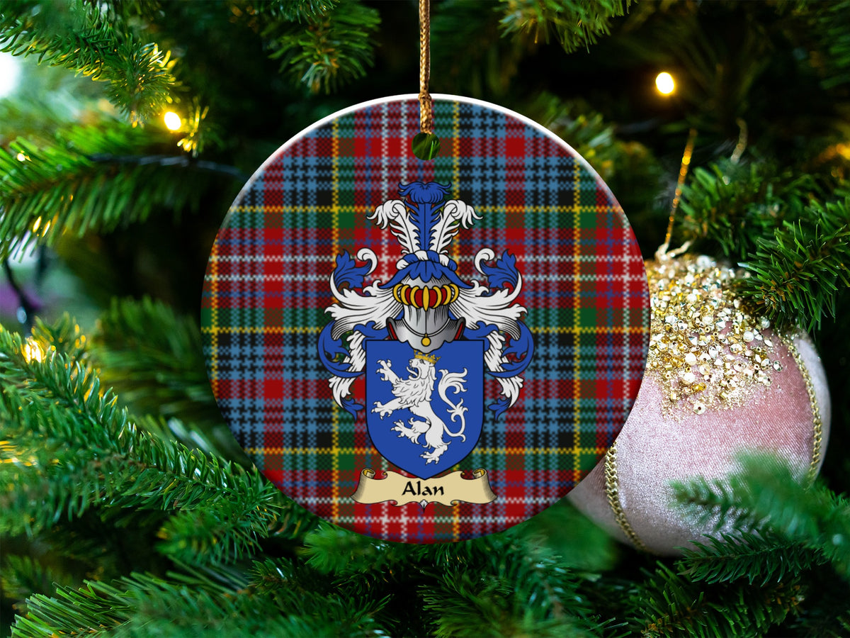 Alan Scottish clan ceramic ornament with family crest on a Caledonia tartan background, hanging on a Christmas tree