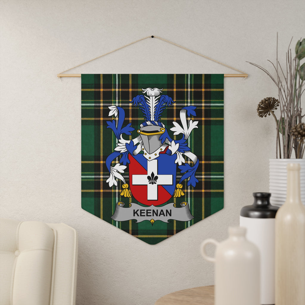 Keenan family crest on green plaid fabric pennant hanging on wall