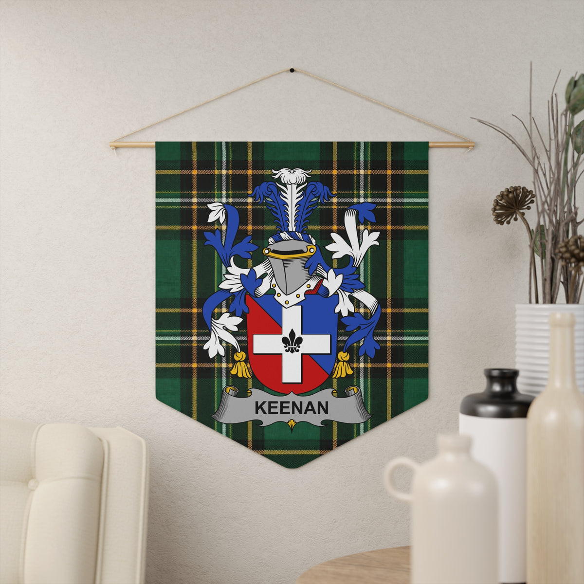 Keenan family crest on green plaid fabric pennant hanging on wall