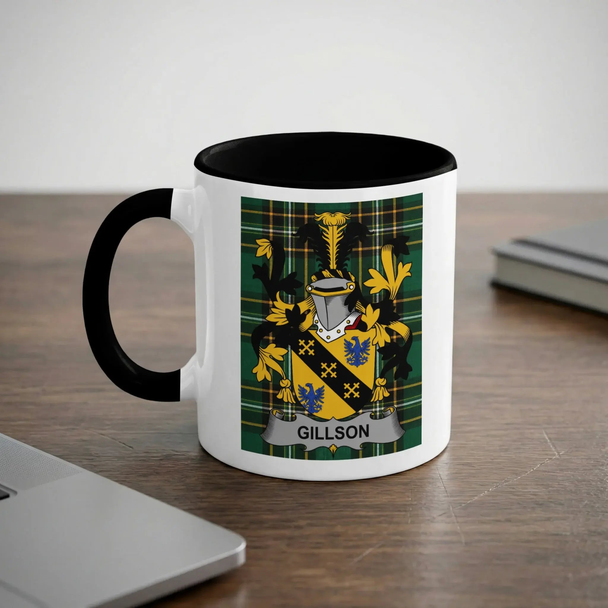 White mug with black handle featuring the Gillison family crest.