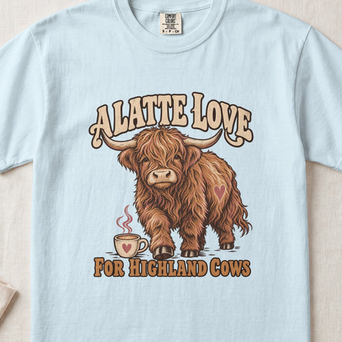 A Latte Love for Highland Cows Highland cow design on a Chambray Comfort Colors 1717 T-shirt, flat lay
