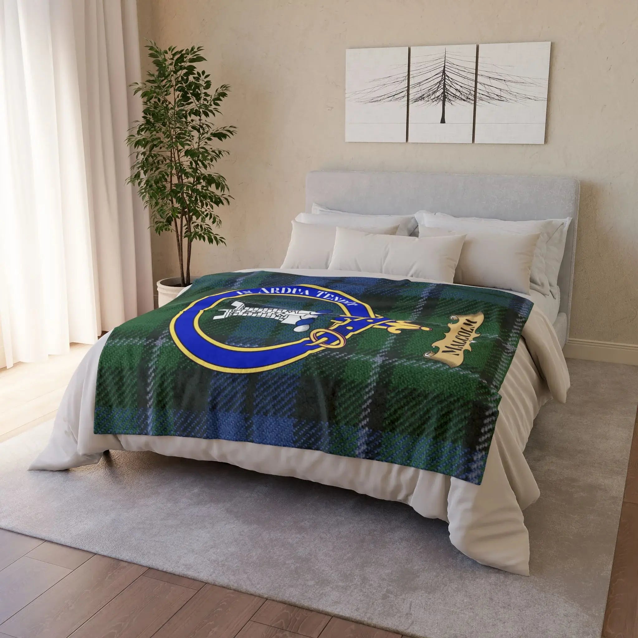Malcolm clan crest printed blanket showing blue and green plaid with Malcolm name and tower emblem