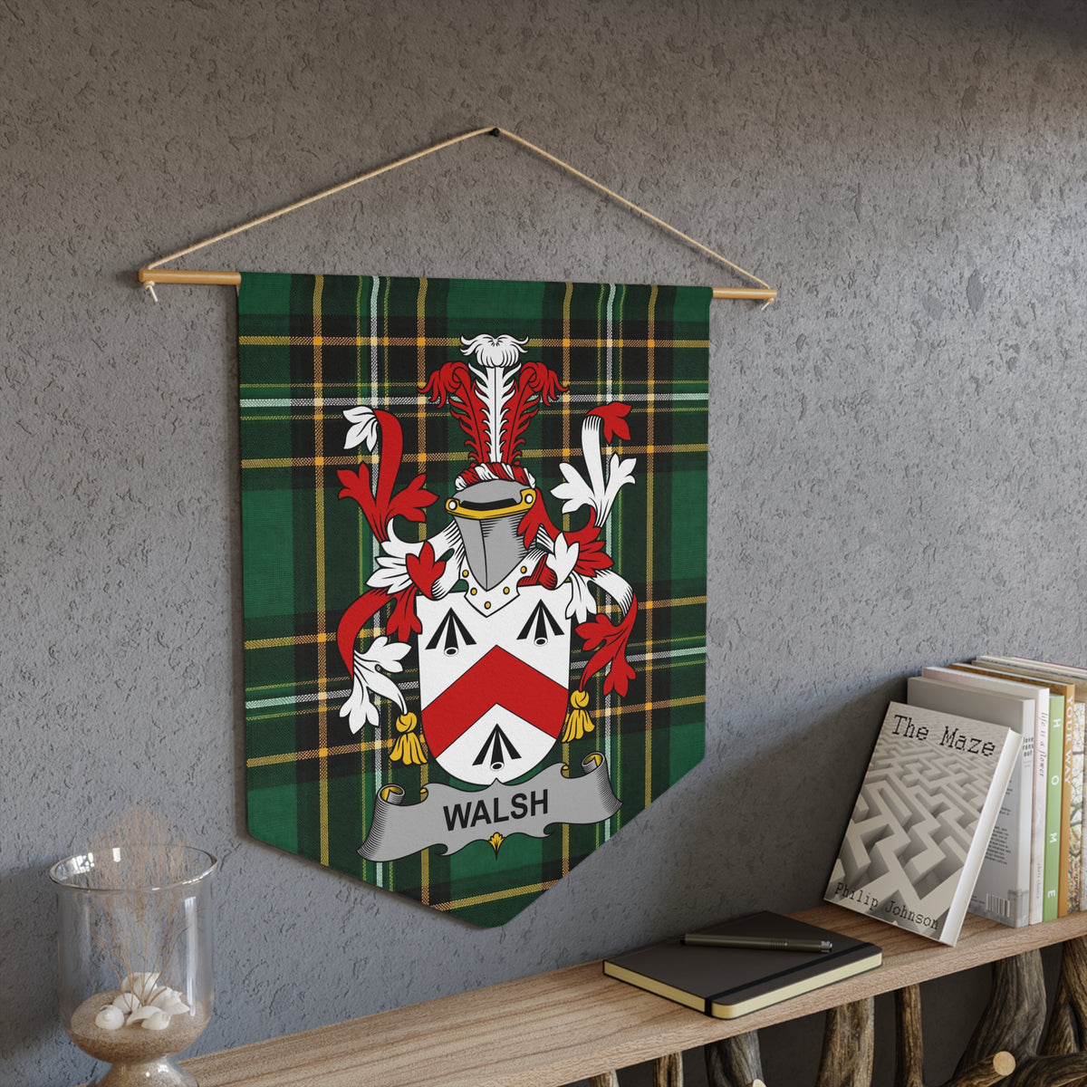 Walsh family crest on green tartan pennant hanging on wall.