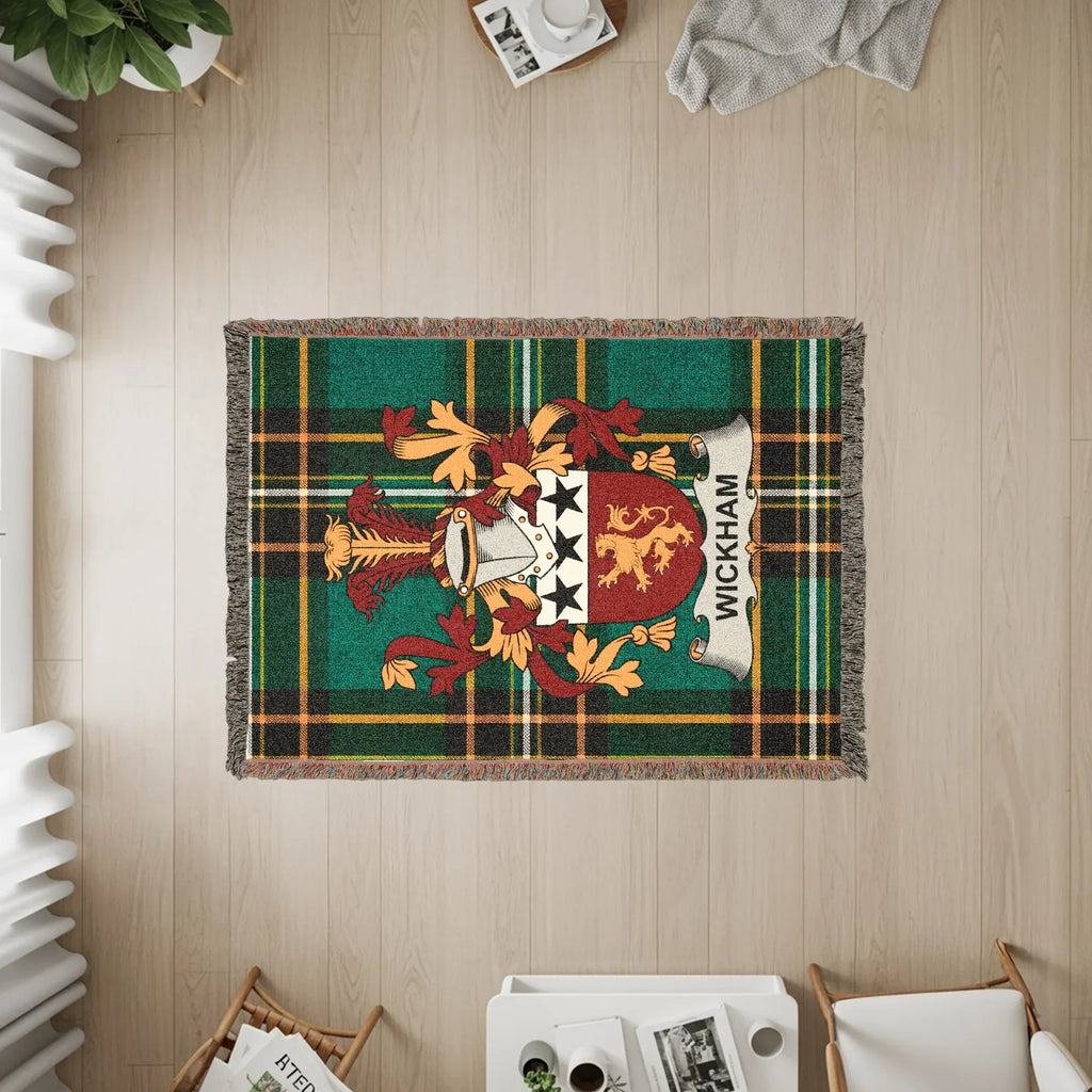 Wickham crest on a green plaid woven blanket with fringe.