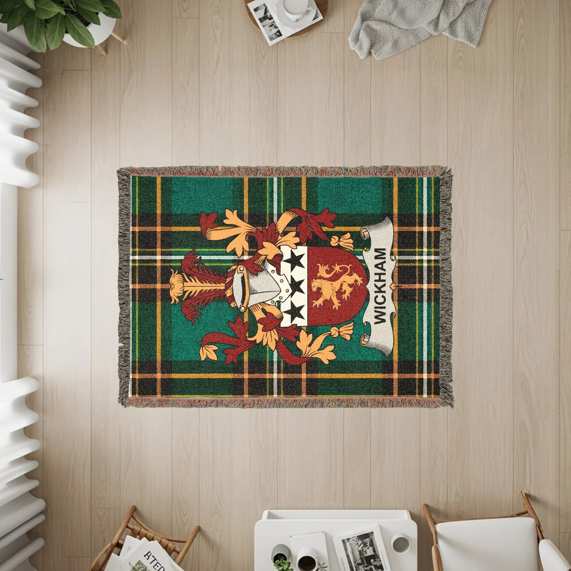 Wickham crest on a green plaid woven blanket with fringe.