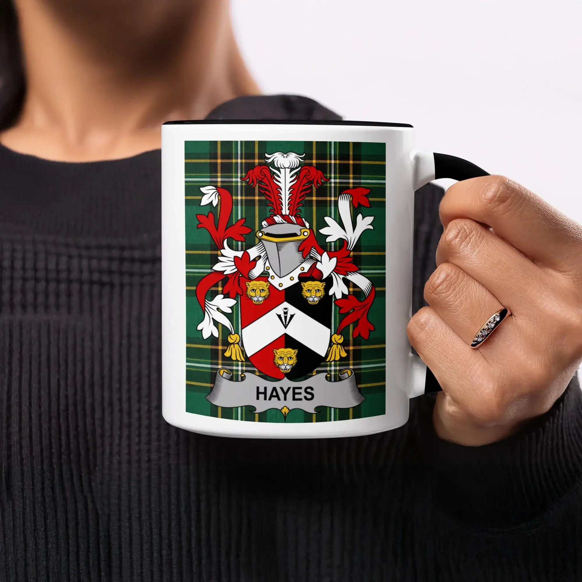 Mug with the Hayes family crest on a green tartan background.