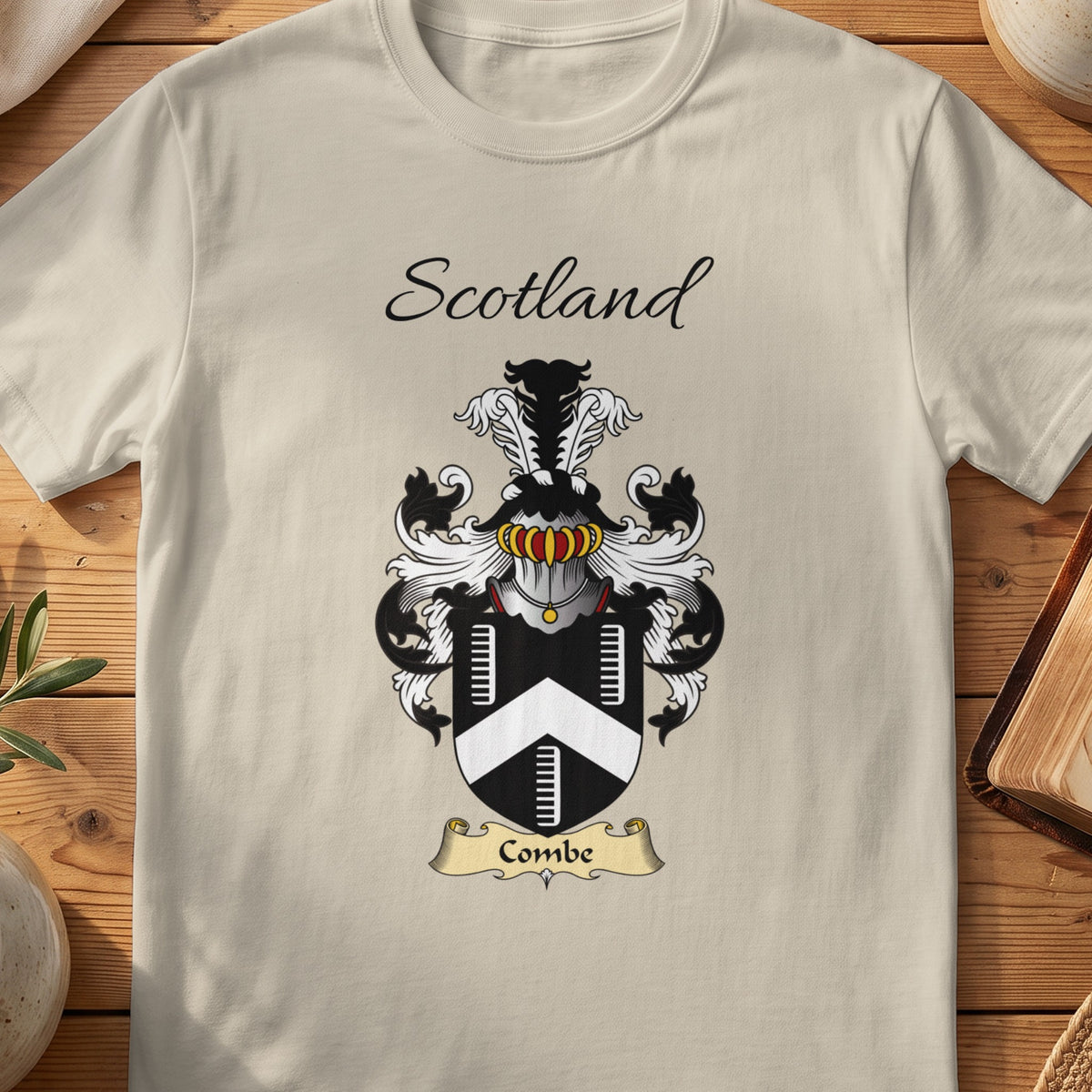 Sand Combe Scottish family shield T-shirt featuring a white chevron between ladder-like motifs on black