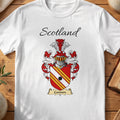 White Cannon Scottish family shield T-shirt featuring red-and-gold diagonal stripes with a black roundel