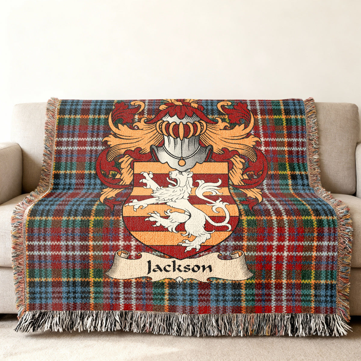Jackson family crest emblem on a Caledonia tartan woven blanket